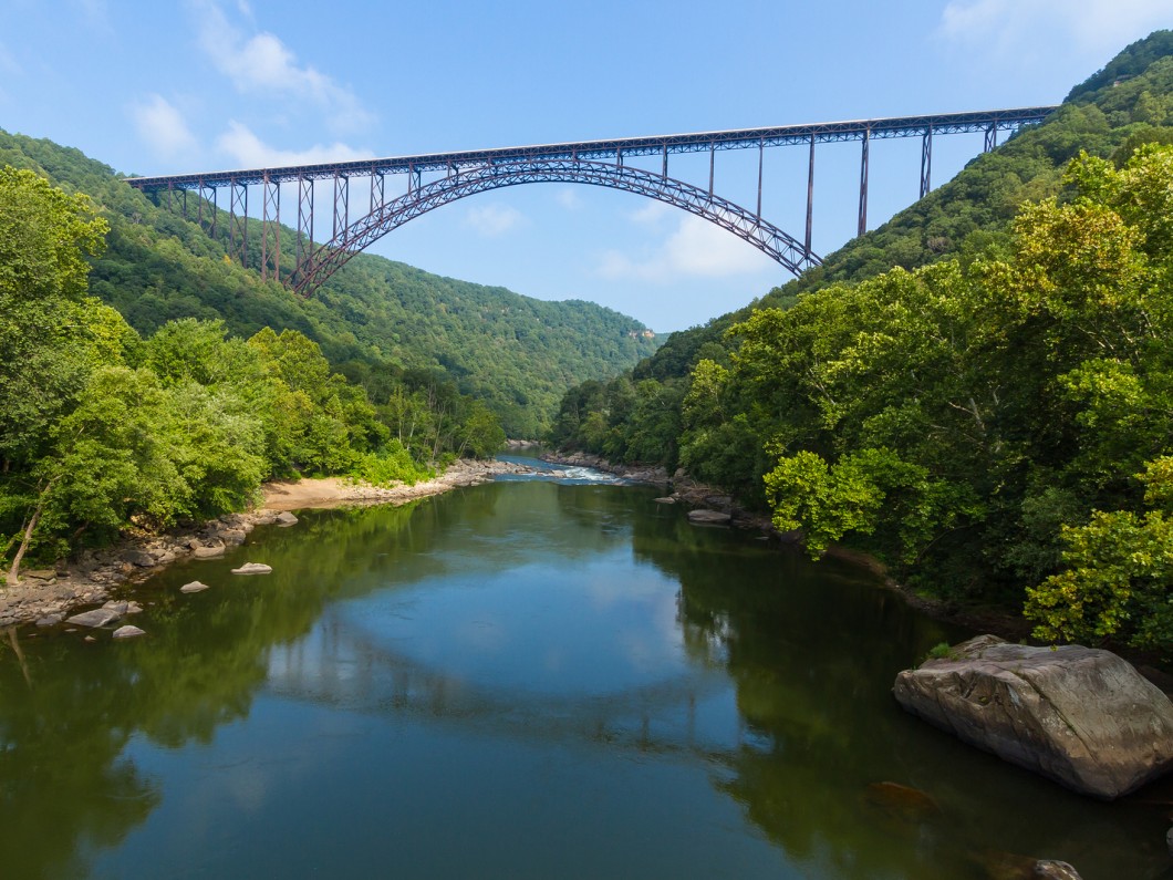 long bridge suspended over a stream