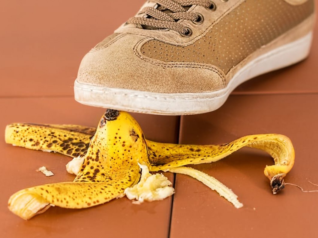 shoe hovering over a banana peel